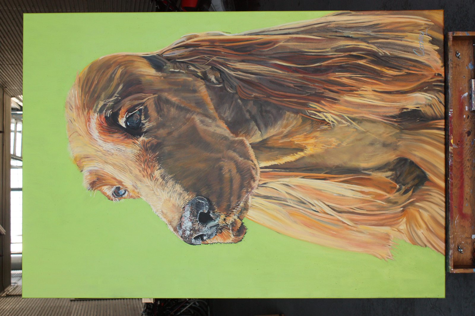 Horizontal painting of a long-haired golden dog against a green background.